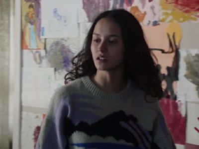 Erana James is wearing a sweater with mountains made on it.